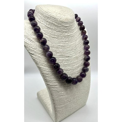 643 - A Deep Shades of Purple Amethyst Graduated Bead Necklace. 10-15mm.