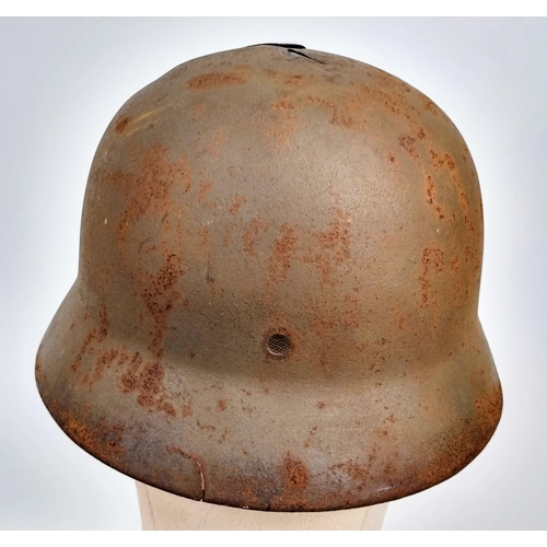 151 - WW2 German Battle Damaged M35 Hitler Youth Helmet.