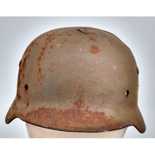 151 - WW2 German Battle Damaged M35 Hitler Youth Helmet.