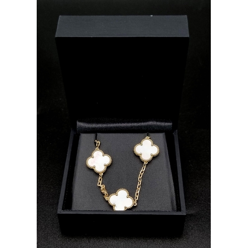 342 - A Van Cleef and Arpels Alhambra chain with 10 motifs - 18ct yellow gold with mother of pearl motif i... 