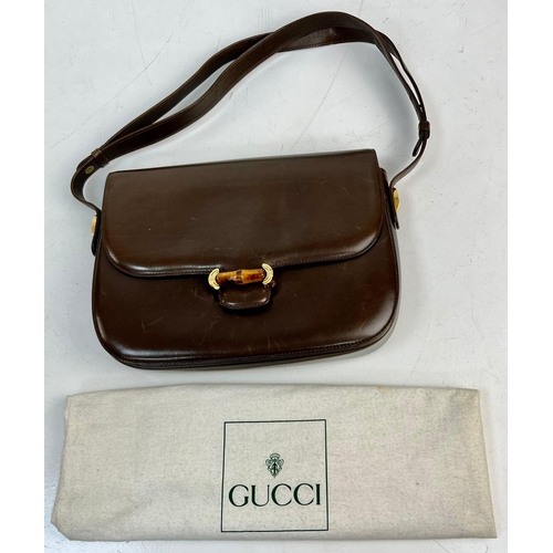 501 - A Brown Leather Gucci Horse-Bit Shoulder Bag. Gilded and bamboo hardware. Suede interior with zipped... 