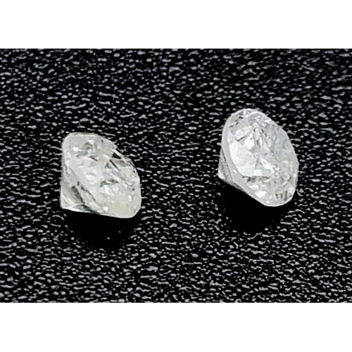 616 - Pair of round brilliant diamonds, 0.44 carats in total.