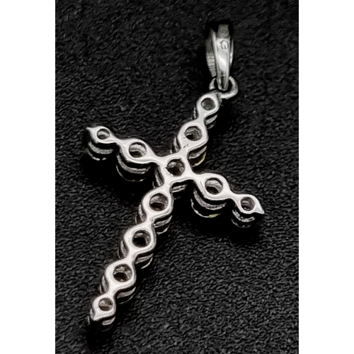 623 - 19k white gold diamond and yellow sapphire cross pendant. 1g in weight.