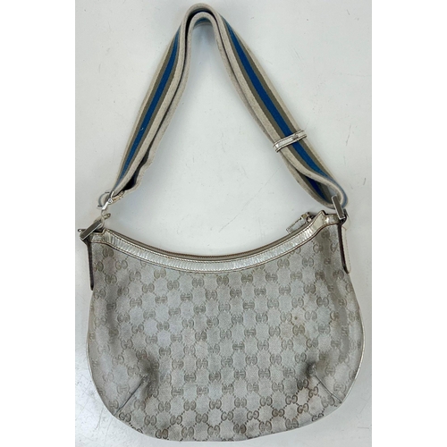 854 - A ladies GUCCI silver bag. Dimensions: 31 x 25 cm, fabric strap.