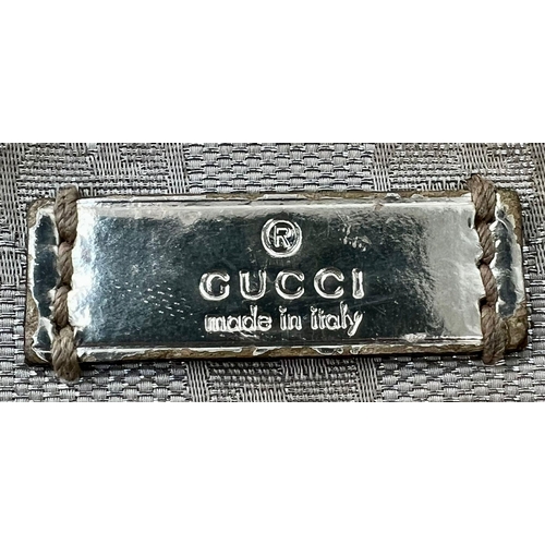 854 - A ladies GUCCI silver bag. Dimensions: 31 x 25 cm, fabric strap.