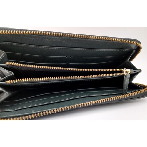 494 - A hand made, large, black, crocodile leather wallet with internal zipped compartment. Dimensions: 20... 