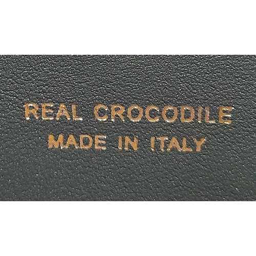 494 - A hand made, large, black, crocodile leather wallet with internal zipped compartment. Dimensions: 20... 