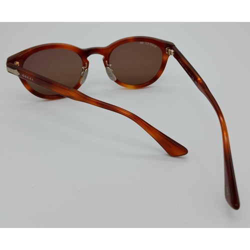 629 - A PAIR OF GUCCI TITANIUM SUNGLASSES