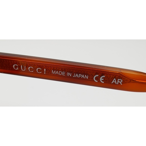 629 - A PAIR OF GUCCI TITANIUM SUNGLASSES