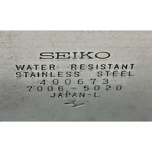 815 - A SEIKO AUTOMATIC WATCH WITH LARGE SQUARE FACE AND STEEL STRAP.   36 X 34mm