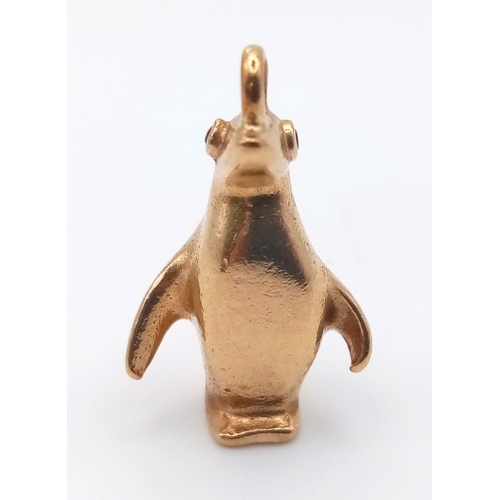 270 - A mid century stylised 9ct yellow gold charm in the form of a penguin by Hans Georg Maunter. It is a... 