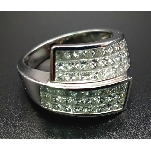 347 - An 18 K white gold ring with two triple bands of round cut quality diamonds (1.73 carats). Ring size... 