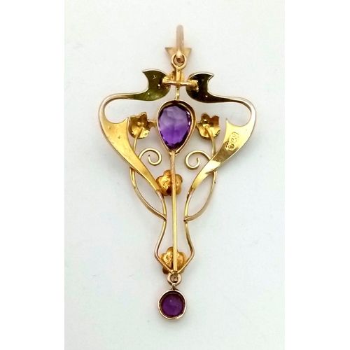 446 - A Victorian 9K Gold Amethyst and Seed Pearl Pendant. 5cm.
2.5g total weight.