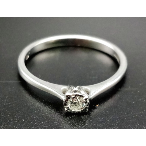 550 - A 9K White Gold Diamond Solitaire Ring. 0.1ct diamond. Freshly rhodium coated . Size O 1/2. 2g total... 