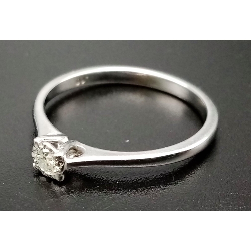 550 - A 9K White Gold Diamond Solitaire Ring. 0.1ct diamond. Freshly rhodium coated . Size O 1/2. 2g total... 