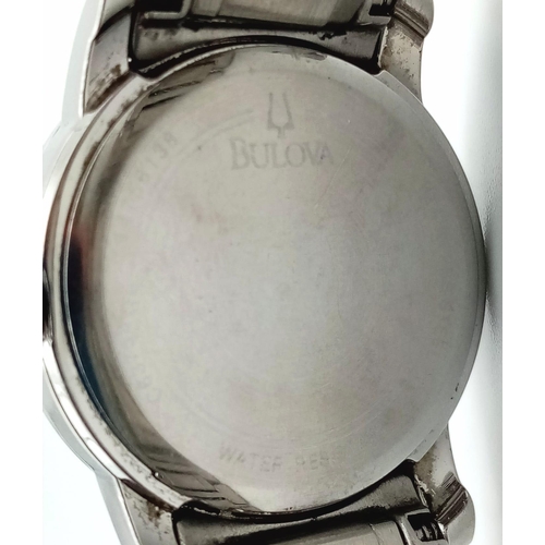 829 - A BULOVA LADIES WATCH WITH DIAMOND NUMERALS AND BEZEL.  30mm