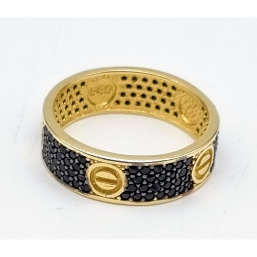 875 - A 14 K yellow gold ring with black sapphires. Ring size: S, weight: 4.22 g