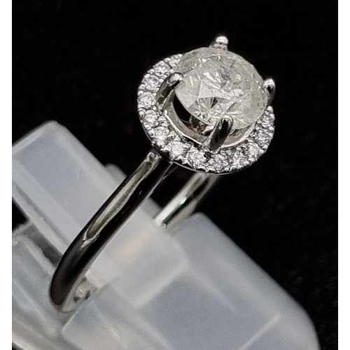 57 - 18k white gold halo solitaire ring. Approximately 1ct centre diamond, 3.6g, size M.