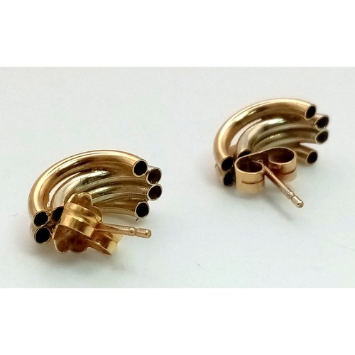 820 - A Pair of 9K Yellow Gold Wave Stud Earrings. 1.4g