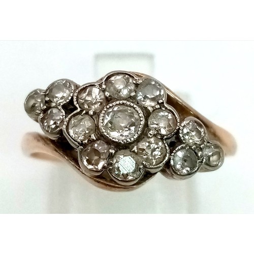 47 - An Antique 15K Rose Gold Diamond Crossover Ring. Central diamond with a halo of diamonds - 1ct. Fift... 