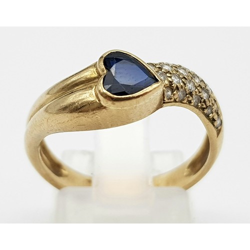 648 - A 9K Yellow Gold Sapphire Heart and Diamond Wave Love Ring. Size O. 3.51g total weight.