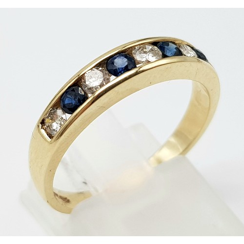 442 - 9k diamond and sapphire channel set. 1/2 eternity ring. 2.8g, size P.