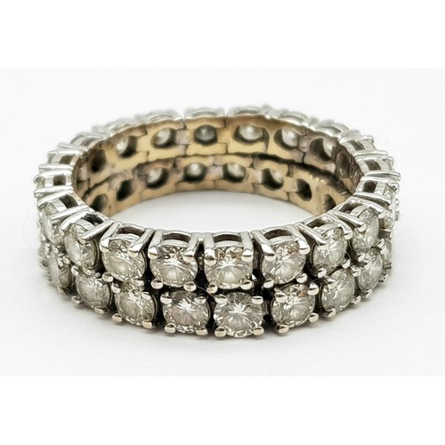 115 - An 18K White Gold 40 Diamond Full Eternity Ring. Double-row chain-link with 2.8ct of round cut diamo... 