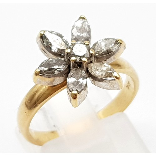 129 - An 18K Yellow Gold Diamond Flower Ring. Central round diamond surrounded by six oval petal diamonds ... 