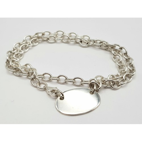 889 - Sterling silver ID necklace. 17.5g in weight.