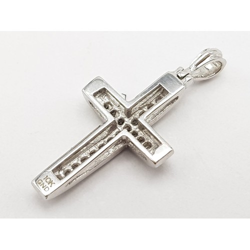 477 - 9k white gold diamond cross pendant. 1g in weight.