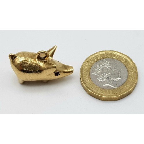 1012 - A mid century stylised 9 carat yellow gold charm in the form of a Pig by Hans Georg Maunter. It is a... 