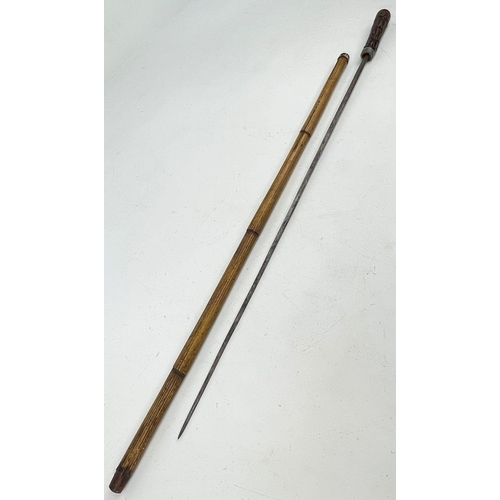 121 - A Rare Antique Chinese Walking Stick with Hidden Sword. Decorative handle. Total length - 80cm.