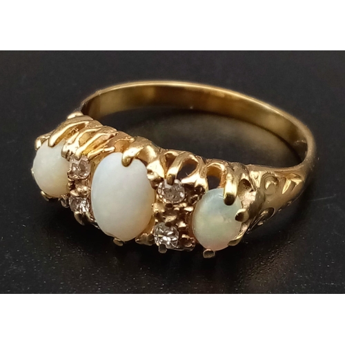 184 - A Victorian High Karat Gold Opal and Diamond Ring. Three opals separated by four diamonds set in a s... 