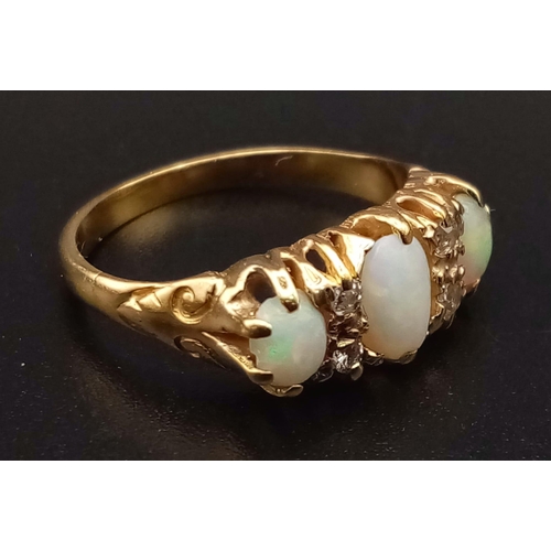 184 - A Victorian High Karat Gold Opal and Diamond Ring. Three opals separated by four diamonds set in a s... 