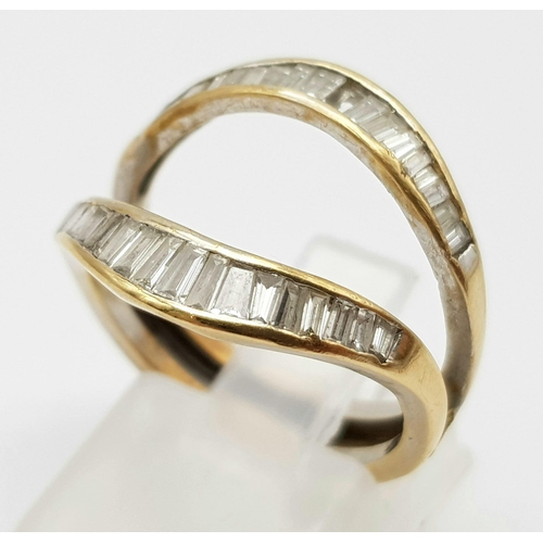 210 - A High Karat (tested) Yellow Gold Graduated Baguette-cut Diamond Ring. Size N. 4.76g total weight. N... 