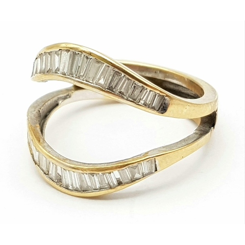 210 - A High Karat (tested) Yellow Gold Graduated Baguette-cut Diamond Ring. Size N. 4.76g total weight. N... 