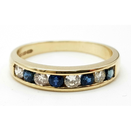 442 - 9k diamond and sapphire channel set. 1/2 eternity ring. 2.8g, size P.