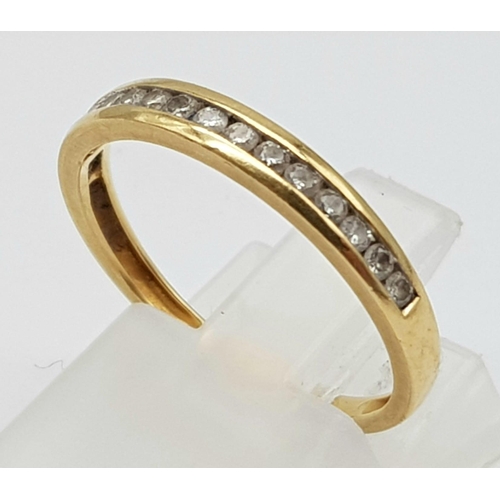 609 - 18k yellow gold diamond 1/2 eternity ring. 0.18ct, 1.8g, size M.