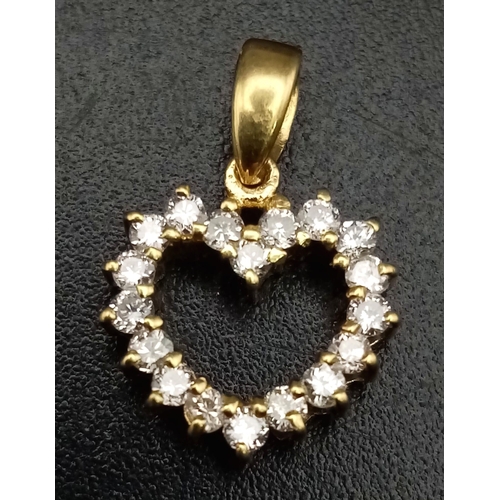 683 - An 18K Yellow Gold Diamond Heart Pendant. Clean white round cut stones for a loved one. 15mm. 1g tot... 