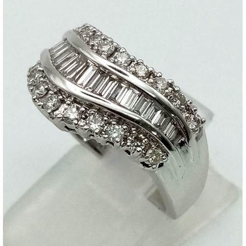 171 - An 18 K white gold ring with wavy band of baguette cut diamonds accompanied by further two bands of ... 