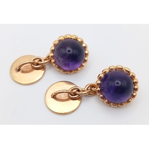 62 - A Wonderful Pair of 1950s Amethyst and High Karat Gold Cufflinks. Beautiful domed amethysts. 10.51g ... 