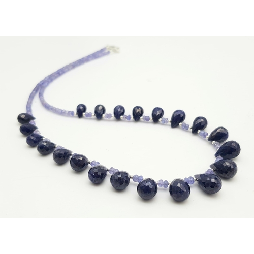 1183 - A 125ct Single row Tanzanite Necklace with Sapphire Drops, with a 925 Silver Clasp. 44cm.