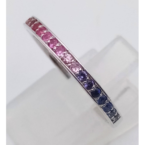 233 - A stunning Theo Fannell half eternity ring set with a rainbow of colour of natural sapphire. All unh... 