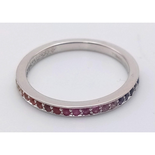 233 - A stunning Theo Fannell half eternity ring set with a rainbow of colour of natural sapphire. All unh... 