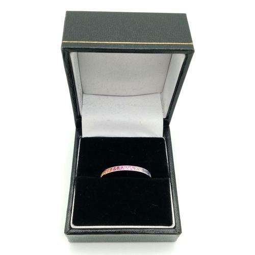 233 - A stunning Theo Fannell half eternity ring set with a rainbow of colour of natural sapphire. All unh... 