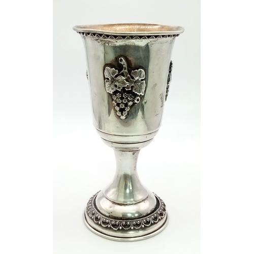 694 - An Antique Silver Kiddush Cup With Plate. Grape decoration. Plate -11cm diameter. Cup 13cm tall. 122... 