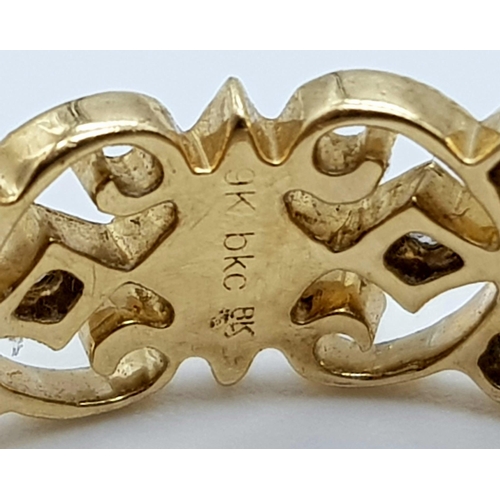 808 - A vintage, 9 K yellow gold ornate ring with diamonds. Ring size: N1/2, weight: 285 g.