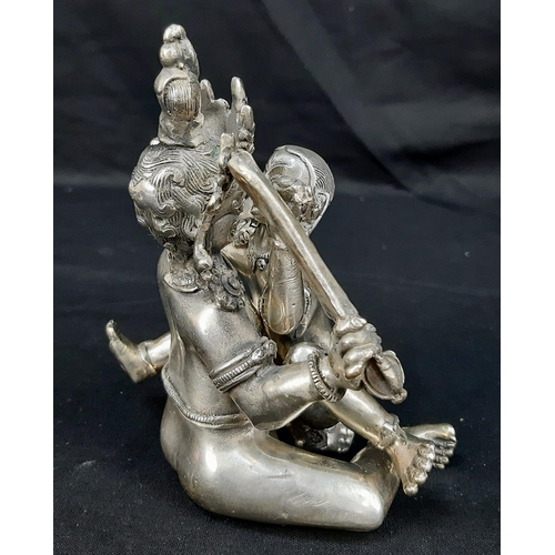 176 - An antique, Tibetan silver, statue, inspired by the ancient Sanskrit text of Kama Sutra. It consists... 