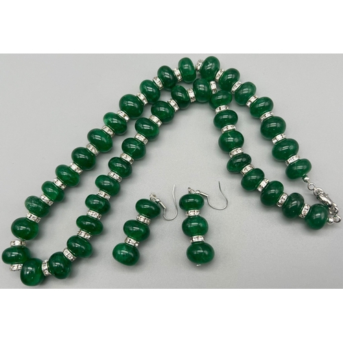 197 - A very elegant and sophisticated necklace and earrings set with large emerald cabochons and cubic zi... 