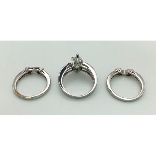 232 - A brilliant trilogy of sterling silver rings with cubic zirconia, presented in a vintage, blue and w... 